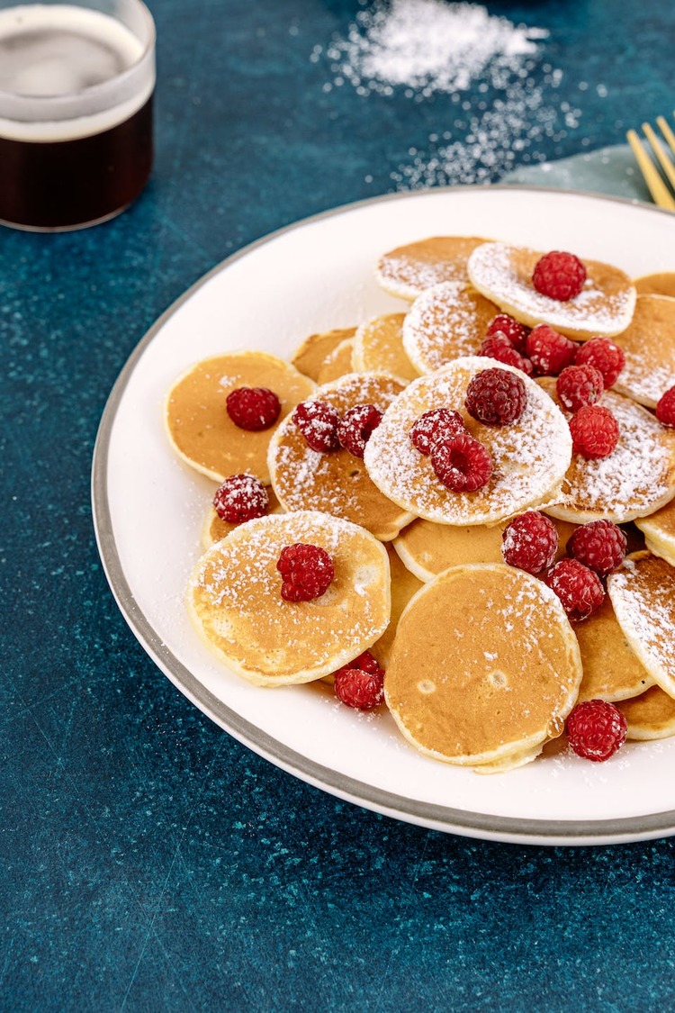 Mini Hotcakes with Raspberries and Powdered Sugar
